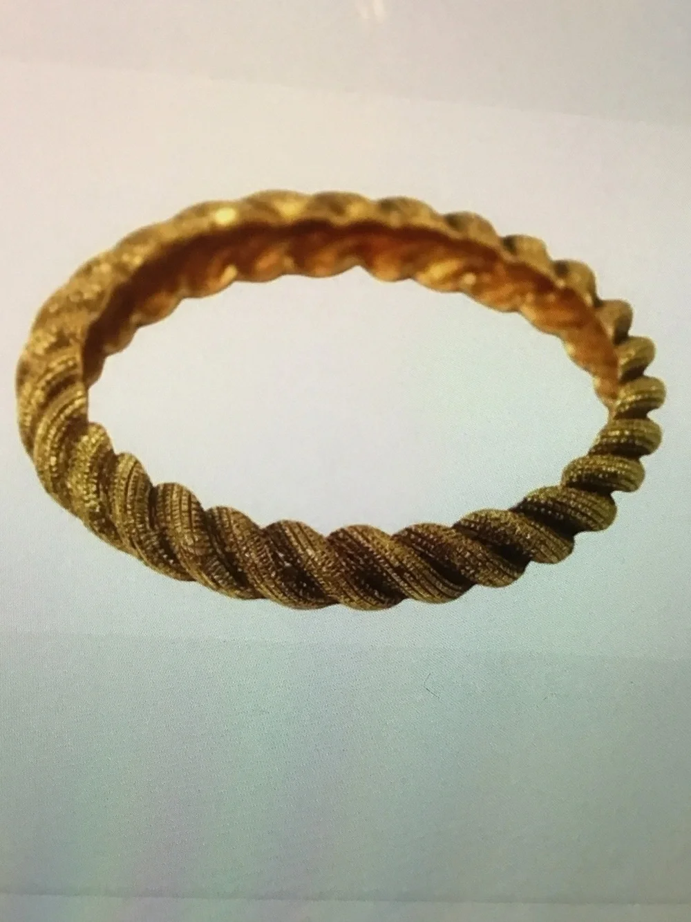 Authentic vintage CHANEL Twisted Rope Bangle in Gold Tone circa early 1990’s